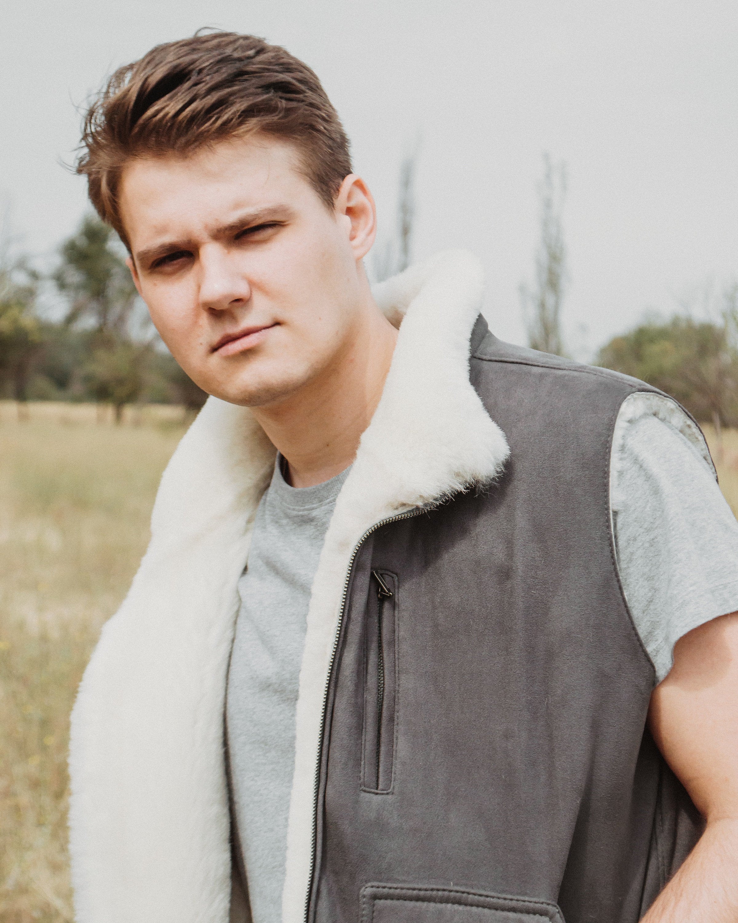 Grey Sheepskin Vest with Contrasting White Fur Lining with Wide Pockets